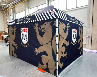 Blue and gold branded gazebo for Belvedere College featuring college crest, suitable for outdoor school events in Ireland