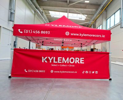 Red-branded gazebo for Kylemore Cars, used at promotional events and car shows in Ireland