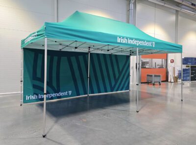 White and green branded gazebo for Irish Independent, providing a strong marketing presence at outdoor Irish events
